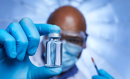 Man holding a vial